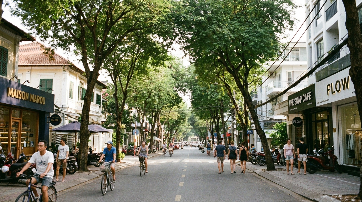 The Thao Dien neighbourhood in District 2 Thu Duc City Saigon with tree-lined expat streets, Western-style cafe fronts, people cycling, and a pleasant suburban international feel